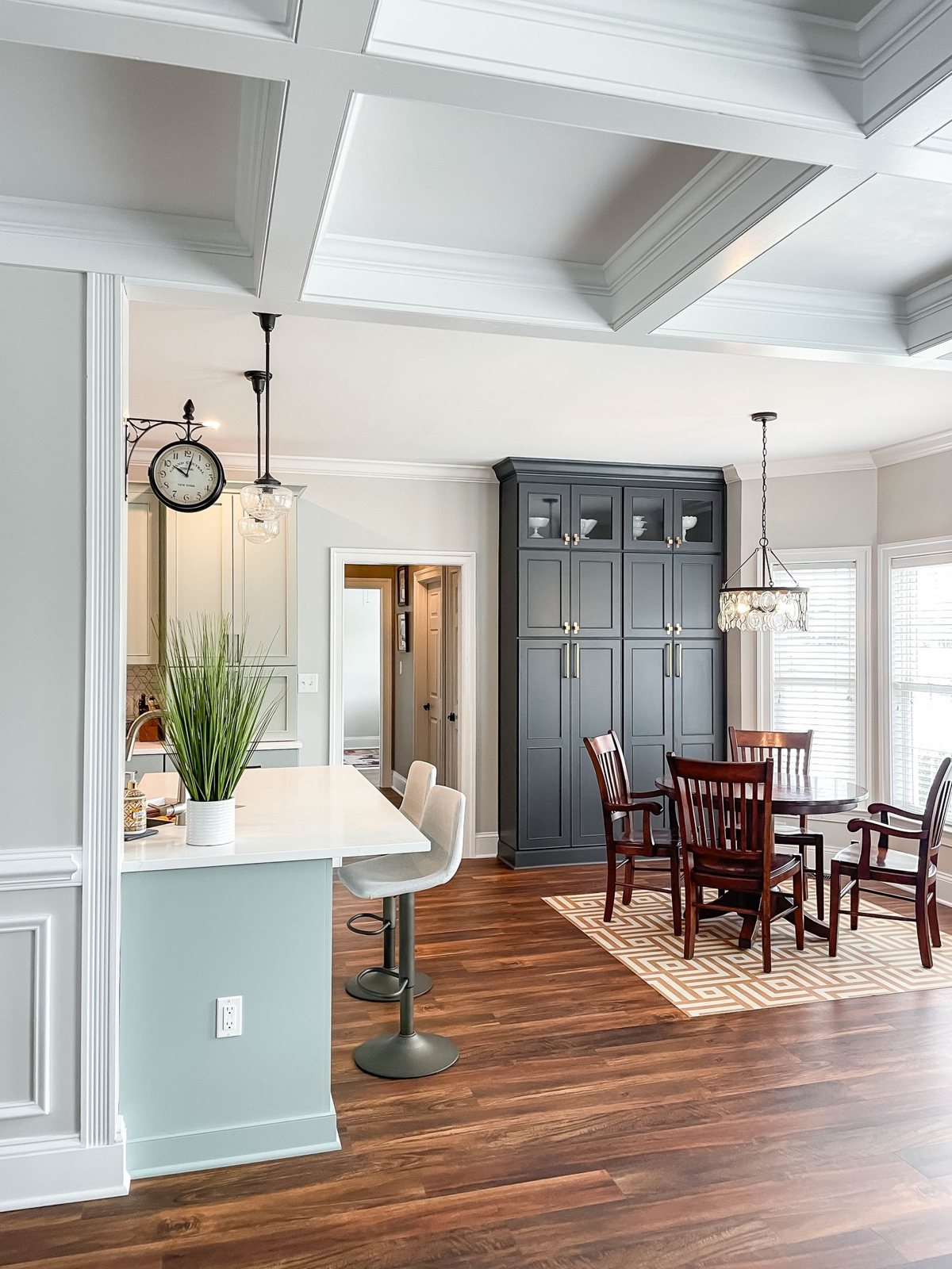 Kitchen and dining room under a coffered ceiling in a Winchester, VA home finished by Sidney Design and Build