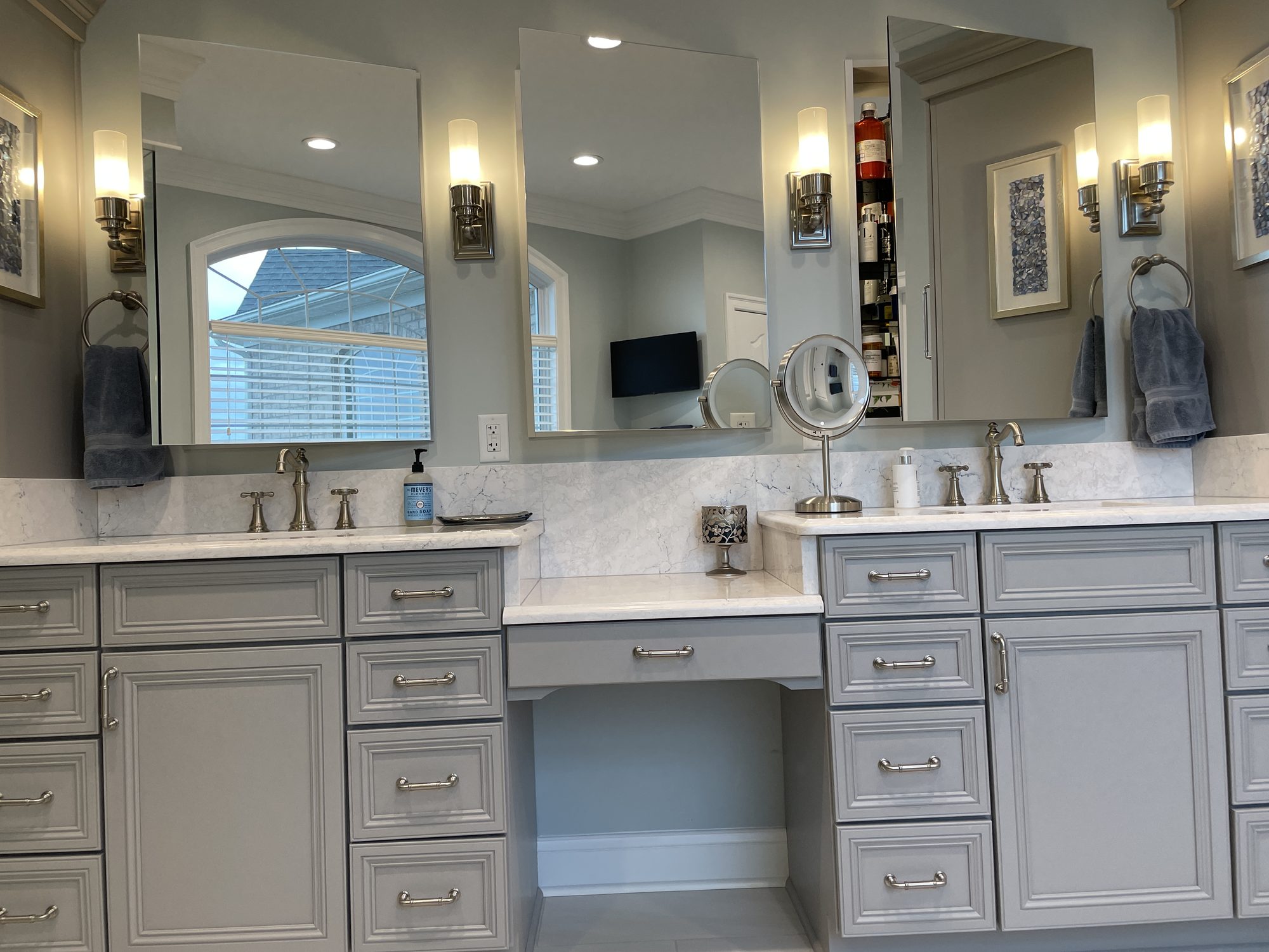 Double vanity with a makeup station, a bathroom remodel by Sidney Design and Build in Winchester, VA