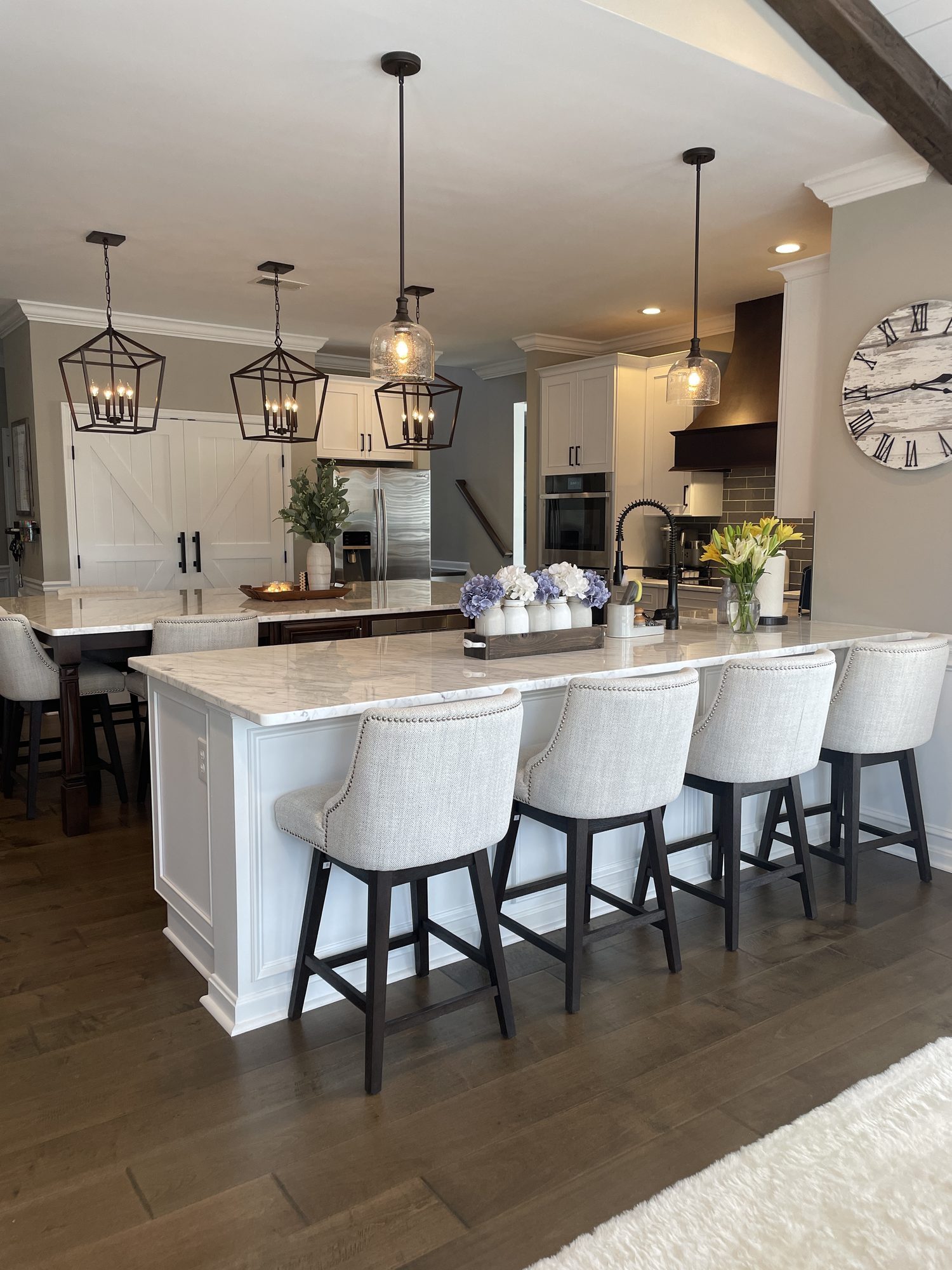 Long island, lantern pendants, seating for four, a kitchen remodel by Sidney Design and Build in Winchester, VA