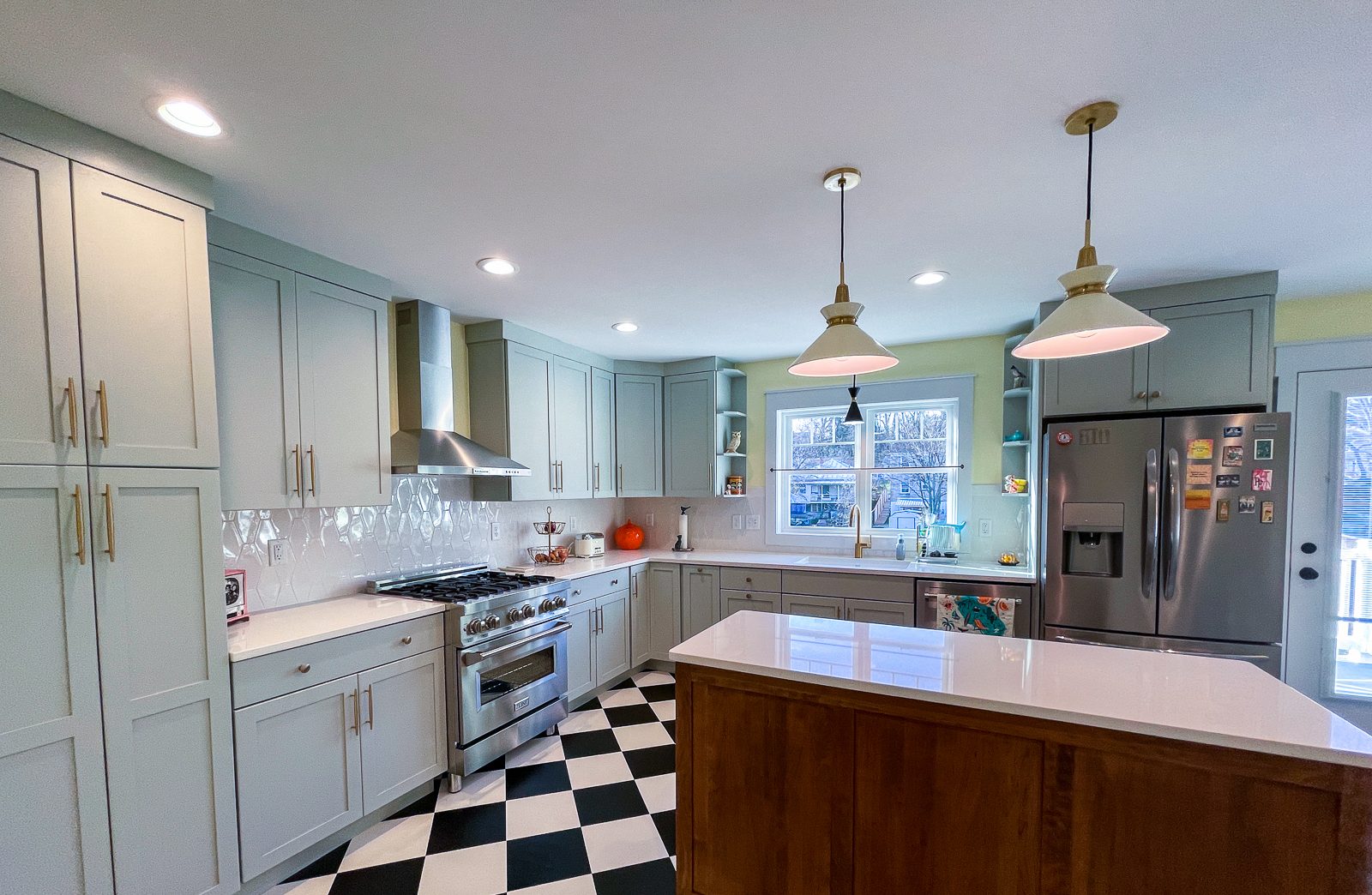 Walnut island on a checkerboard floor, a kitchen remodel by Sidney Design and Build in Winchester, VA