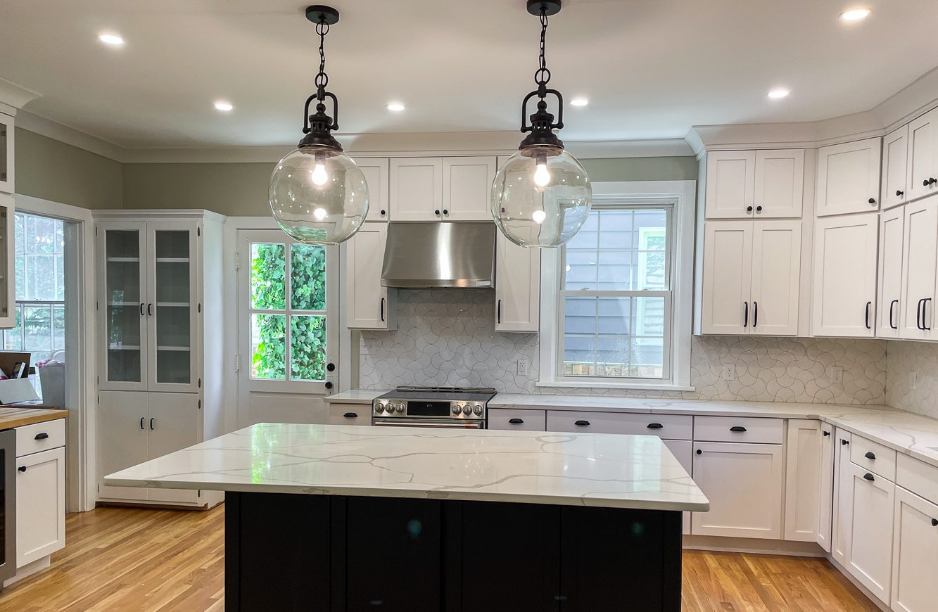 Black island, white perimeter, a kitchen remodel by Sidney Design and Build in Winchester, VA