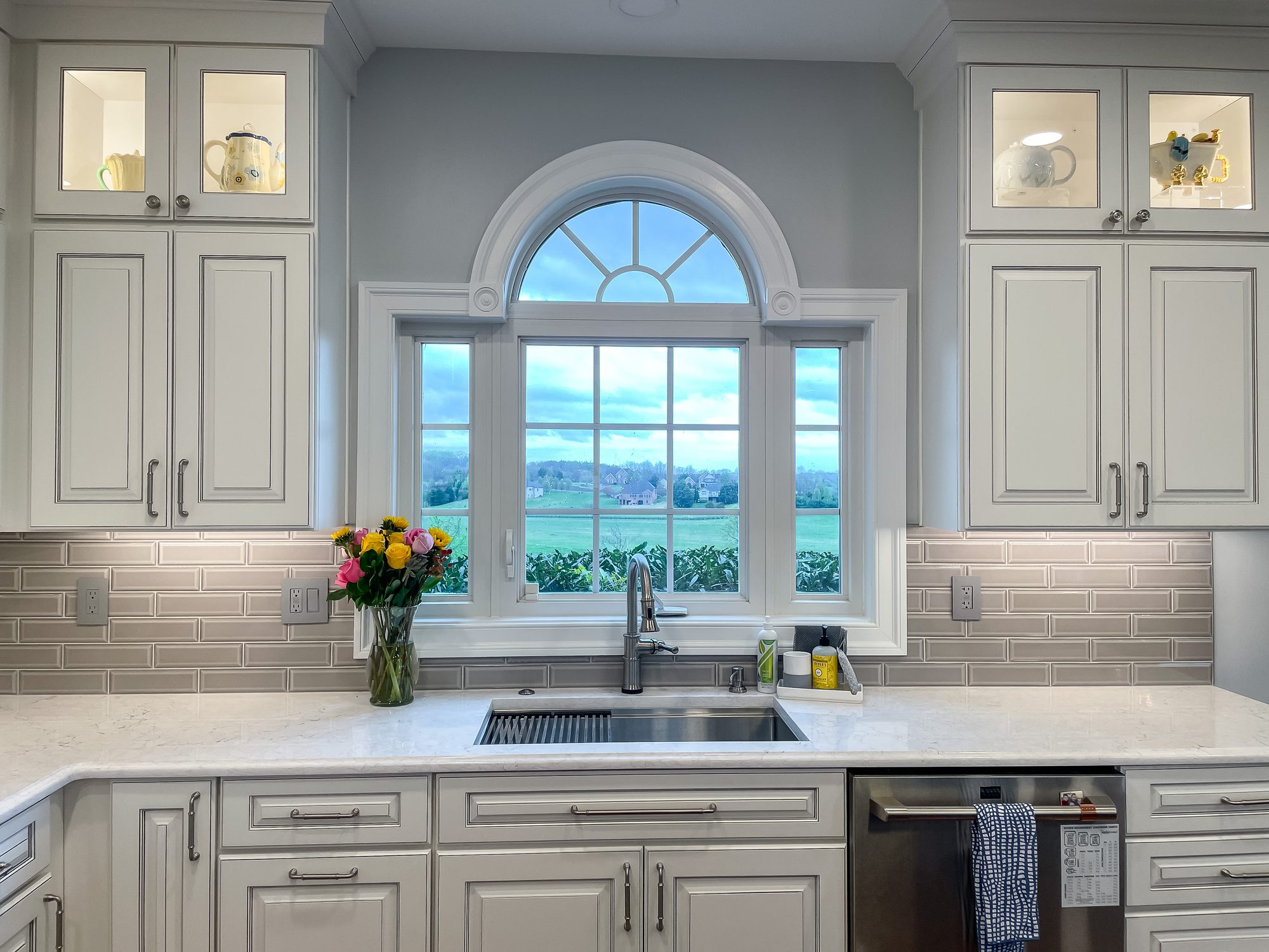 Arched window over the sink, a kitchen remodel by Sidney Design and Build in Winchester, VA