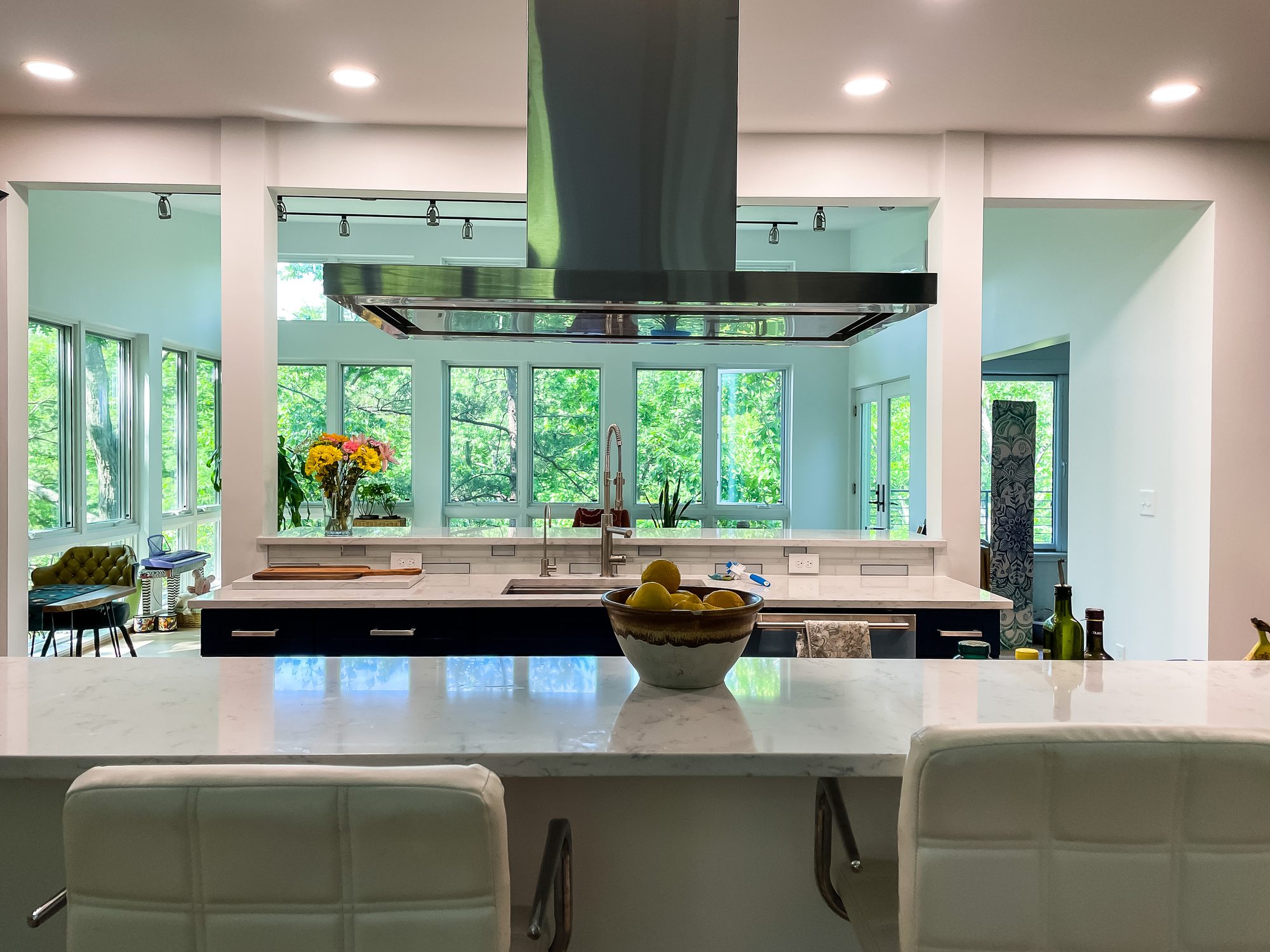 Island hood and a wall of windows, a kitchen remodel by Sidney Design and Build in Winchester, VA